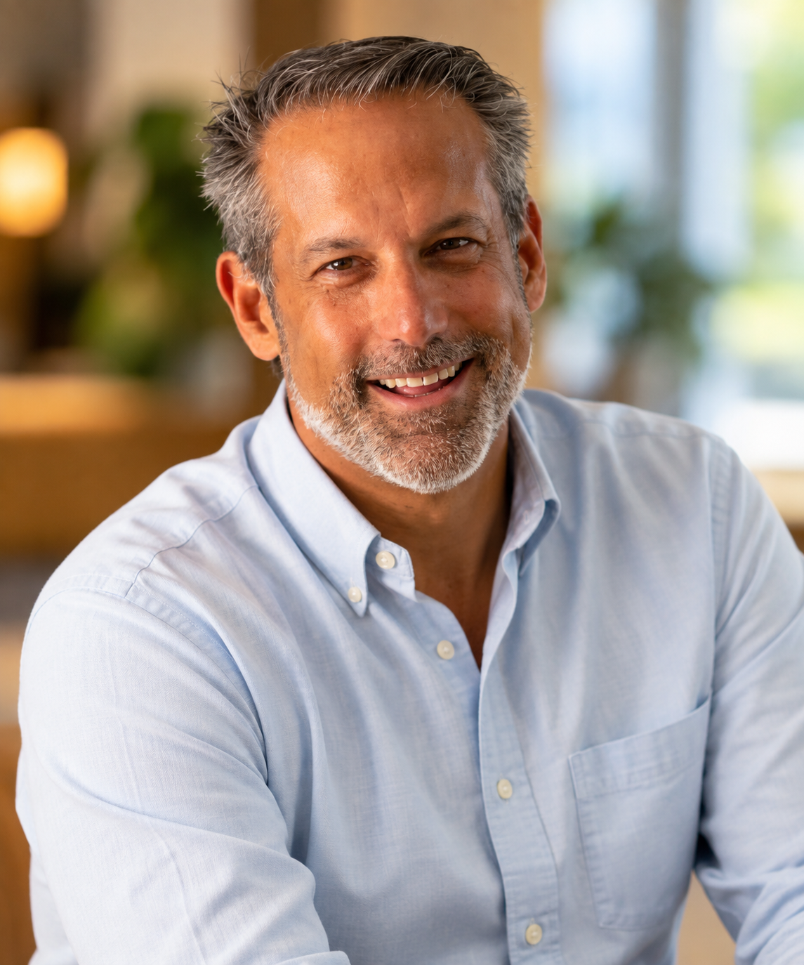 Michael Cherenson smiling in a light blue shirt