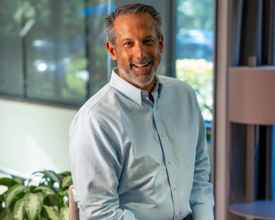 Michael Cherenson smiling in a professional office setting